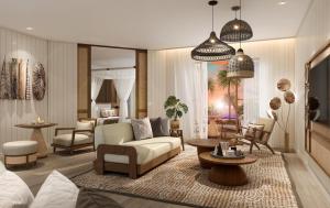 InterContinental Lifou Wadra Bay Resort في Akaouane: غرفة معيشة مع أريكة وطاولة