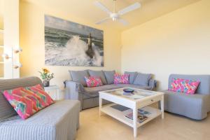 a living room with a couch and a table at Marbella Este Next Marriott and Nikki B - Happy Rentals in Marbella