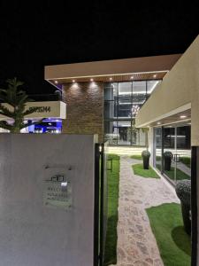 an external view of a building at night at G R A N D C H A L E T in Salalah