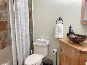 a bathroom with a toilet and a sink and a shower at Hot Tub . Near Freeway . Quick 2 Theme Parks/Beach in Huntington Beach