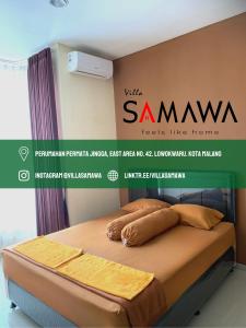 a poster of a bed in a bedroom with a samsung sign at Villa Samawa in Malang