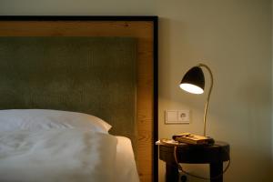 Postel nebo postele na pokoji v ubytování Hotel Lechnerhof Unterföhring