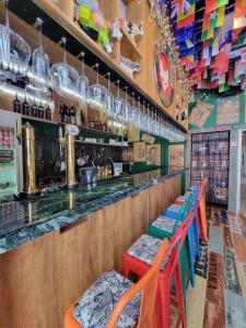 a bar with colorful chairs and a counter at Q FOX BLACK DIAMOND HOTEL in Niseko