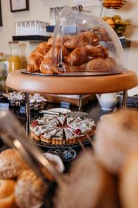 a bunch of pastries and other pastries on display at Hotel KUNST in Krško