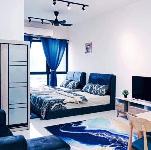 a living room with a bed and a couch at Tulip Touch Homestay Kota Warisan KLIA Sepang in Sepang