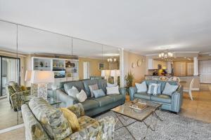 a living room with two couches and a table at Inlet Reef 102 Destin Condo in Destin