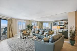 a living room with a couch and a table at Inlet Reef 102 Destin Condo in Destin