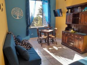 a living room with a couch and a table at La Casa di Carta FIUGGI in Fiuggi