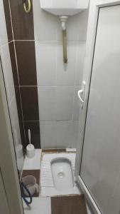 a small bathroom with a toilet in a stall at KK4 İMZAOĞLU 6 in Istanbul