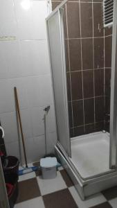 a bathroom with a shower with a toilet in it at KK4 İMZAOĞLU 6 in Istanbul