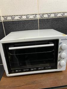 a white toaster oven sitting on top of a counter at KK4 İMZAOĞLU 6 in Istanbul