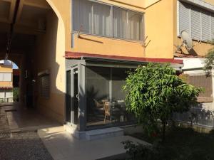 a window of a building with a chair in it at Summer Villa with pools, beach area, free sun loungers and free car park in Side