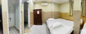 Postel nebo postele na pokoji v ubytování Thuy Van Hotel