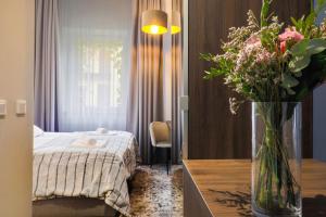 Posteľ alebo postele v izbe v ubytovaní Aparthotel Cracovia Residence