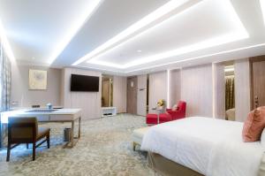 Un televizor și/sau centru de divertisment la The Excelton Hotel