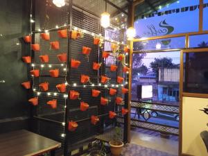a wall with hearts on it with lights at Leo's Residency Coorg in Kushālnagar