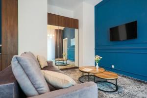 Televízia a/alebo spoločenská miestnosť v ubytovaní Aparthotel Cracovia Residence