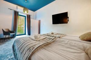 Posteľ alebo postele v izbe v ubytovaní Aparthotel Cracovia Residence