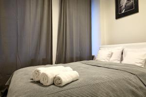 Posteľ alebo postele v izbe v ubytovaní oompH Warsaw Central Premium Apartments