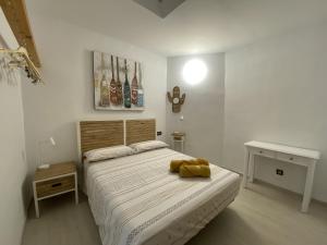 Posteľ alebo postele v izbe v ubytovaní spazioso e incantevole, funzionale, Wi-Fi, AC, patio, piscina condivisa
