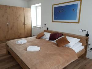 Posteľ alebo postele v izbe v ubytovaní Apartament Zimowiec