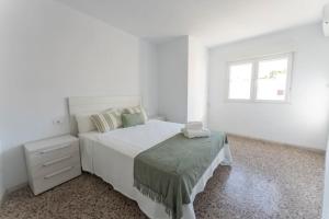 Posteľ alebo postele v izbe v ubytovaní Precioso apartamento en altura
