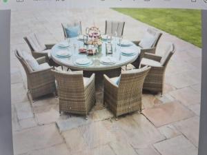 a table with wicker chairs and a table and a table and chairs at Newly Converted One of a Kind Farmhouse Villa In Gozo in Għarb