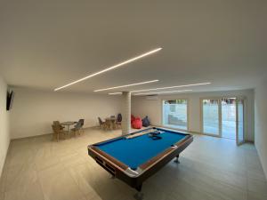 a living room with a pool table in it at Camping San Michele in Moniga
