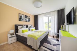 En eller flere senge i et værelse på Villa SCHLOSSBLICK WE4 Penthouse am Nationalpark