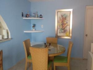 a dining room with a glass table and chairs at Room in Guest room - Best bed and breakfast in Samana Breakfast Included in Santa Bárbara de Samaná