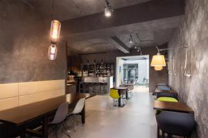 a restaurant with tables and chairs and a bar at MOODs boutique hotel in Prague