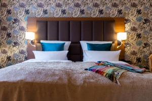 Postel nebo postele na pokoji v ubytování Parkhotel Görlitz