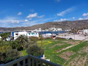 a view of a town from the balcony of a house at Diasino Apartments and Car Rental in Katapola