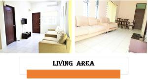 ein Wohnzimmer mit einem Sofa und einem Wohnbereich in der Unterkunft A&W Homestay, Vista Perdana, Miri in Miri