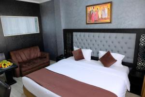 Een bed of bedden in een kamer bij Washington Hotel