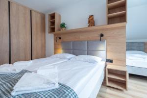Posteľ alebo postele v izbe v ubytovaní Apartamenty na Uroczysku