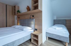 Posteľ alebo postele v izbe v ubytovaní Apartamenty na Uroczysku