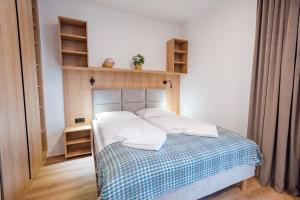 Posteľ alebo postele v izbe v ubytovaní Apartamenty na Uroczysku