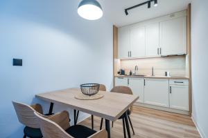 Kuchyňa alebo kuchynka v ubytovaní Apartamenty na Uroczysku