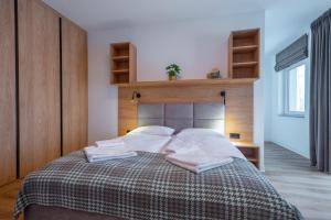 Posteľ alebo postele v izbe v ubytovaní Apartamenty na Uroczysku