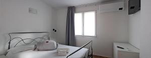 מיטה או מיטות בחדר ב-Agriturismo Pelos
