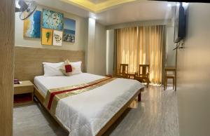 Posteľ alebo postele v izbe v ubytovaní Sunrise Hotel Vung Tau