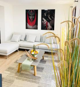 a living room with a couch and a table at Hotel Apartment with 2-en suite Bedrooms in Palma de Mallorca