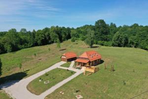 an overhead view of a house in a field at Chalet Markoci With Hot Tub - Happy Rentals in Rakovica