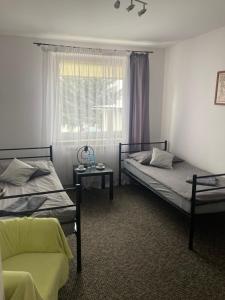 Posteľ alebo postele v izbe v ubytovaní Apartament i pokoje Szalawa