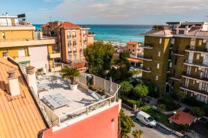an aerial view of a city with the ocean at Ligure Residence in Pietra Ligure
