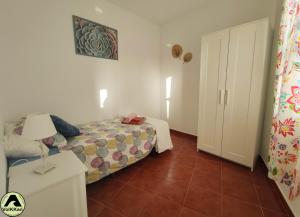 Łóżko lub łóżka w pokoju w obiekcie VolKKanrentals SunBeam House