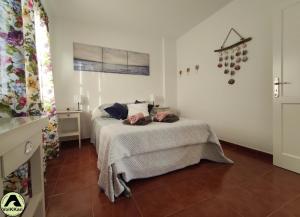 Łóżko lub łóżka w pokoju w obiekcie VolKKanrentals SunBeam House