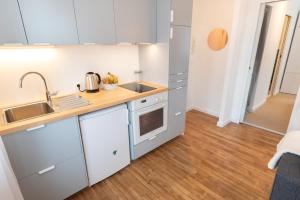 Kuchyňa alebo kuchynka v ubytovaní Appartement T2 neuf, cosy & tout confort - Proche Centre ville par Groom