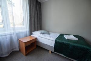 Postel nebo postele na pokoji v ubytování Hotel Felix